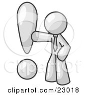 White Businessman Standing By A Large Exclamation Point