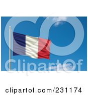 Flag Of France Waving On A Pole Against A Blue Sky