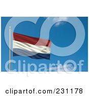 Flag Of Netherlands Waving On A Pole Against A Blue Sky