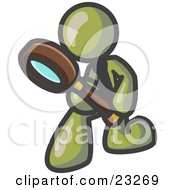Olive Green Man Bending Over To Inspect Something Through A Magnifying Glass