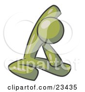 Olive Green Man Sitting On A Gym Floor And Stretching His Arm Up And Behind His Head