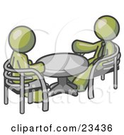 Two Olive Green Business Men Sitting Across From Eachother At A Table During A Meeting