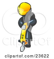 Navy Blue Construction Worker Man Wearing A Hardhat And Operating A Yellow Jackhammer While Doing Road Work