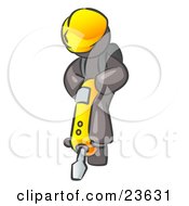 Gray Construction Worker Man Wearing A Hardhat And Operating A Yellow Jackhammer While Doing Road Work