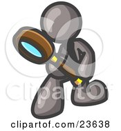 Gray Man Bending Over To Inspect Something Through A Magnifying Glass