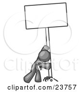 Strong Gray Man Pushing A Blank Sign Upright by Leo Blanchette