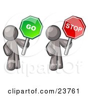 Gray Men Holding Red And Green Stop And Go Signs