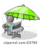 Traveling Gray Business Man Sitting Under An Umbrella At A Table Using A Laptop Computer
