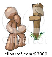 Clipart Illustration Of An Uncertain Brown Man And Child Standing At A Wooden Post Trying To Decide Which Direction To Go At A Crossroads