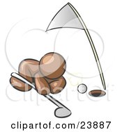 Clipart Illustration Of A Brown Man Down On The Ground Trying To Blow A Golf Ball Into The Hole by Leo Blanchette