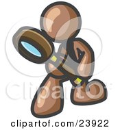 Brown Man Bending Over To Inspect Something Through A Magnifying Glass