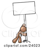 Poster, Art Print Of Strong Brown Man Pushing A Blank Sign Upright