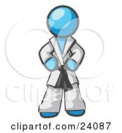 Tough Light Blue Man In A White Karate Suit And A Black Belt Standing With His Hands On His Hips
