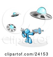 Poster, Art Print Of Light Blue Man Fighting Off Ufos With Weapons