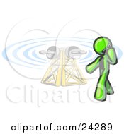 Clipart Illustration Of A Lime Green Businessman Talking On A Cell Phone A Communications Tower In The Background