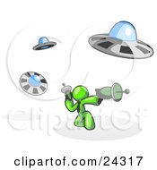 Poster, Art Print Of Lime Green Man Fighting Off Ufos With Weapons
