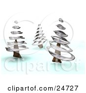 Three Wintry Pink Trees With Silver Spirals In A Winter Landscape