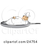 Chubby Male Chef In A White Uniform And Hat Lying On His Side In A Frying Pan