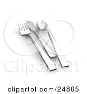 Set Of Chrome Forks Knives And Spoons On A White Counter