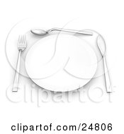 Fork Spoon And Butter Kife Around The Edges Of A Clean White Plate On A Table