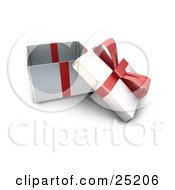 Opened Christmas Gift Wrapped In Silver Paper With A Red Ribbon And Bow