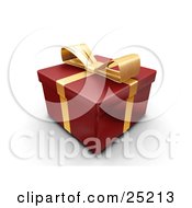 Unopened Christmas Gift Wrapped In Red Paper With A Gold Ribbon And Bow