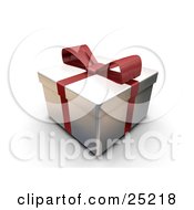 Unopened Christmas Gift Wrapped In Silver Paper With A Red Ribbon And Bow