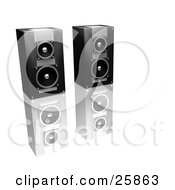 Pair Of Black And Silver Stereo Speakers Side By Side On A Reflective White Surface