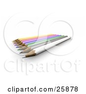 Poster, Art Print Of Row Of Colored Pencils With Sharpened Tips Over White