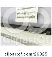Closeup Of The Keys Of A Piano With Sheet Music Propped Up