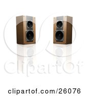 Two Wooden Stereo Speakers Facing Slightly Towards Each Other On A Reflective White Surface