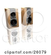 Pair Of Wooden Stereo Speakers Side By Side On A Reflective White Surface