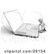 White Character Kneeling To Use A Laptop Computer by KJ Pargeter