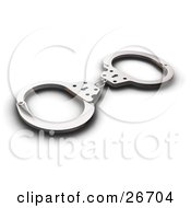 Pair Of Police Handcuffs On A White Background