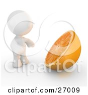 White Meta Man Standing In Front Of A Giant Halved Orange