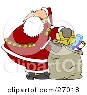 Poster, Art Print Of Santa Claus Looking Over His Shoulder While Stuffing His Toy Sack Full Of Gifts