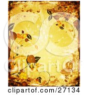 Yellow Grunge Background With Splatters And Smears Bordered By Orange And Brown Leaves And Scrolls