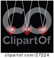 Poster, Art Print Of Three Sparkling Red Disco-Like Heart Pendants Suspended From Silver Necklaces Over A Black Background