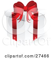 White Christmas Present Box Wrapped With A Red Bow And Ribbon Over White