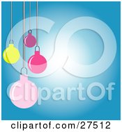 Poster, Art Print Of Yellow Pink And Purple Christmas Tree Ornaments Hanging Over A Gradient White To Blue Background