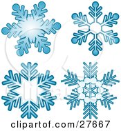 Poster, Art Print Of Four Blue Snowflakes Over A White Background