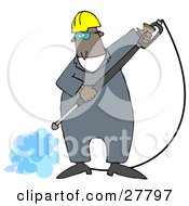 Black Man Wearing Goggles And A Hardhat Spraying The Ground With A Heavy Duty Power Washer Machine