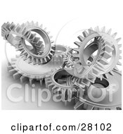 Poster, Art Print Of Clustered Silver Cogs And Gears Working In Unison