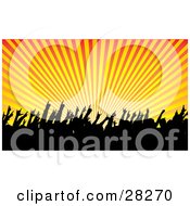 Clipart Illustration Of A Silhouetted Audience Waving Their Hands In The Air In A Concert Over A Bursting Orange And Yellow Background