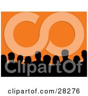 Clipart Illustration Of A Silhouetted Audience Of Men And Women Against An Orange Background