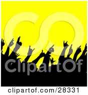 Poster, Art Print Of Black Silhouetted Crowd Waving Their Hands In The Air At A Concert Over Yellow