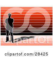 Poster, Art Print Of Black Silhouetted Man With A Shadow Standing Over A Red And Black Striped Background