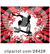 Silhouetted Skateboarder Jumping On His Board Over A Bursting Red And Black Grunge Background