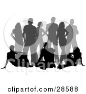 Clipart Illustration Of Three Black Silhouetted Adults Seated In Front Of A Gray Crowd Over White
