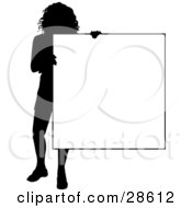 Silhouetted Woman Standing And Holding A Blank Sign Over White